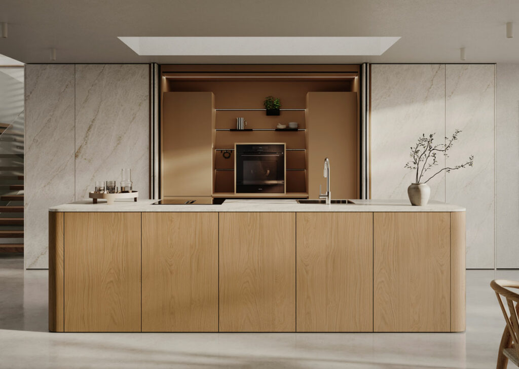 Cuisine Rotpunkt Zerox avec niche à portes escamotables, four cubique et îlot arrondi en décor chêne